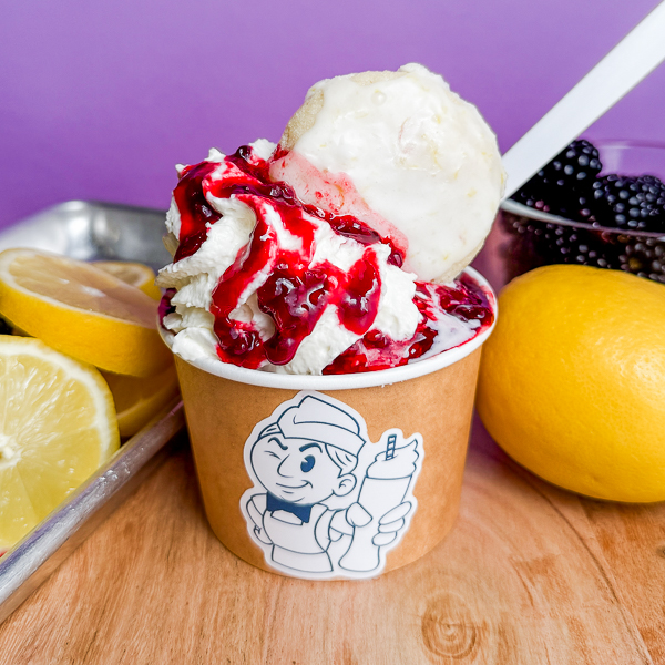 Mom's Sundae Best Mom's Sundae Best in a soda jerk character cup, surrounded by lemons and blackberries.
