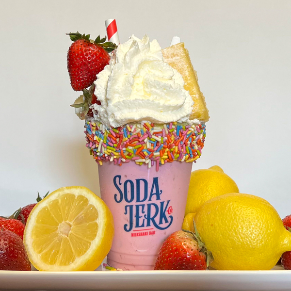 My Main Squeeze My Main Squeeze Killer Shake in a Soda Jerk cup surrounded by lemons and strawberries.