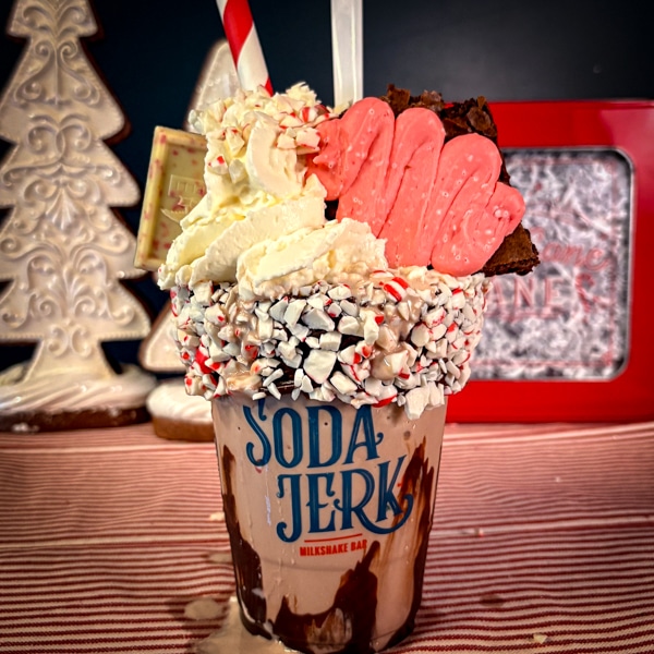 Winter Wonderland shake in a Soda Jerk cup on a Christmas tablecloth.
